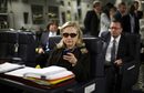 Държавният секретар на САЩ Хилари Клинтън се стараеше да бъде навсякъде през изминаващата година. На снимката тя проверява нещо в телефона си в Малта, минути преди да замине за Либия.