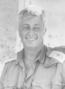 Героят от октомврийската война от 1973 г. - тогава Шарон изненада египетската армия с нощно настъпление през Суецкия канал в 11-ия ден от война. При новината, че примирието предвижда изтегляне на израелската армия от бойните линии, той заяви, че ще подаде оставка в знак на протест.
