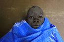 Кенийско момче след ритуал по обрязване в западния регион Бунгома