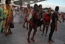 Участнички в модно шоу, организирано от модната къща Daspu, основана и ръководена от проститутки, дефилират по време на фестивала "Жените на света" (WOW) в Рио де Жанейро, Бразилия.