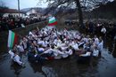 Мъжко хоро в ледените води на река Тунджа на празника Богоявление в Калофер, България.
