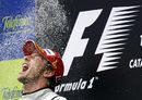 Дженсън Бътън ликува, след като е спечелил едно състезанието за Голямата награда на Испания - една от стъпките към световната титла във Формула 1