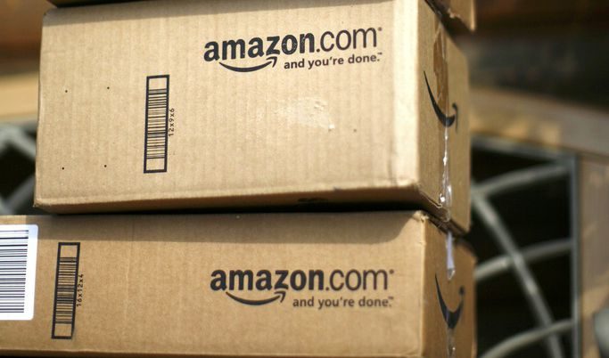 Boxes from Amazon.com are pictured on the porch of a house in Golden, Colorado in this July 23, 2008 file picture. To match Special Report TAX-AMAZON/ REUTERS/Rick Wilking/Files (UNITED STATES - Tags: BUSINESS)