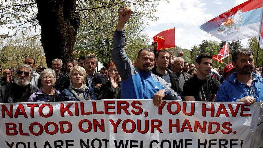 A demonstrator raises his fist during anti-NATO protest as MontenegroвЂ™s parliament discuss NATO membership agreement in Cetinje, Montenegro, April 28, 2017. REUTERS/Stringer